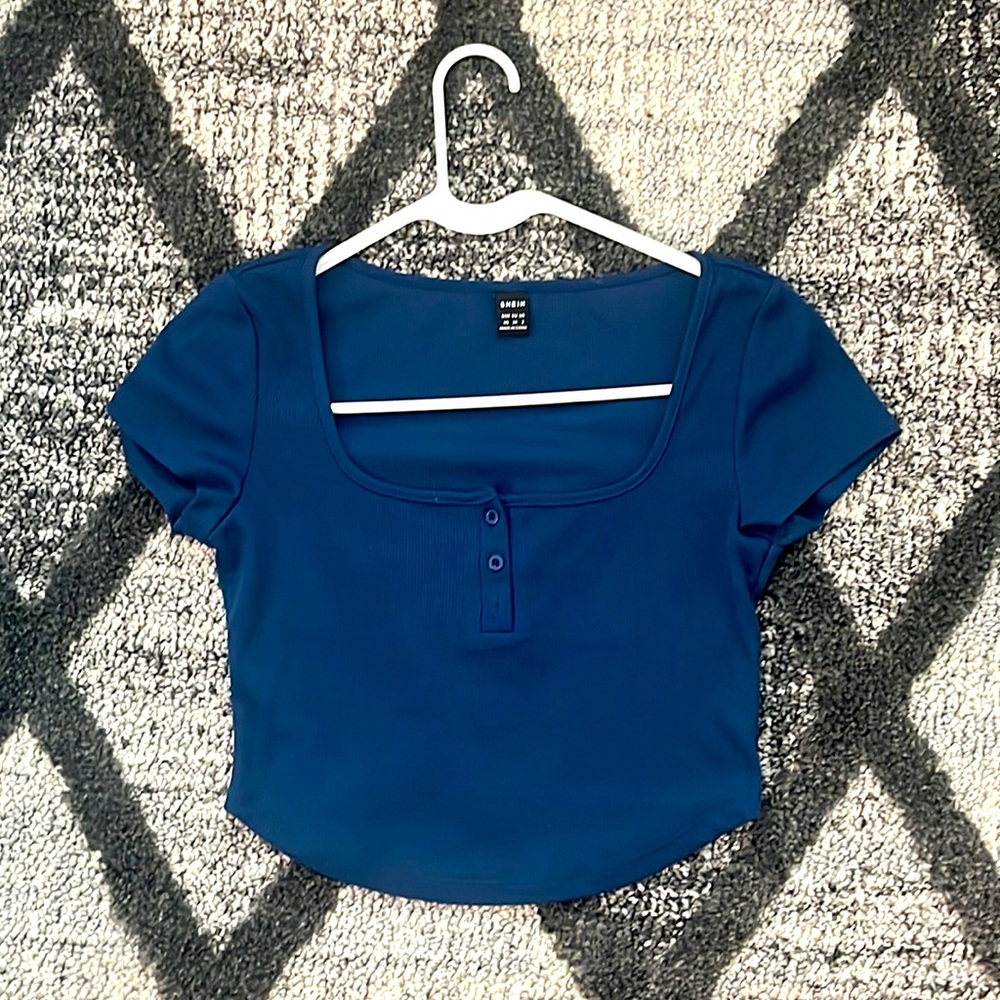 I’m selling a darkish blue button crop top! 💙